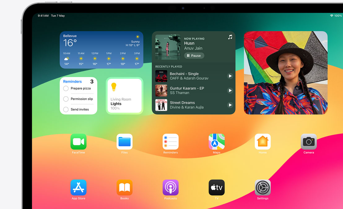 An iPad Pro showcasing Springboard and the different widgets available.