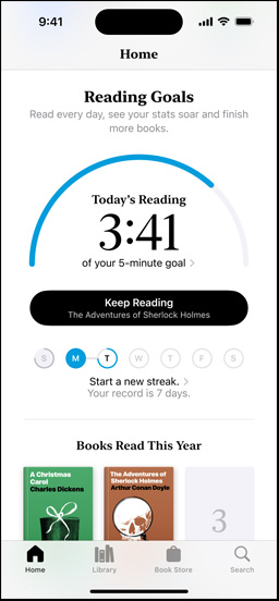 iPhone screen showing the Reading Goals interface in the Books app. At the top, there is a progress ring. Below the progress ring is the weekly reading streak tracker. At the bottom is the Books Read This Year section, which includes a row of two books, with an empty slot for a third