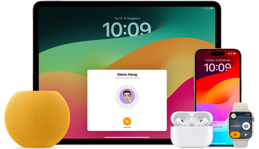 Yellow HomePod mini, an iPad, AirPods in a case, an iPhone and an Apple Watch with a pink strap are arranged.