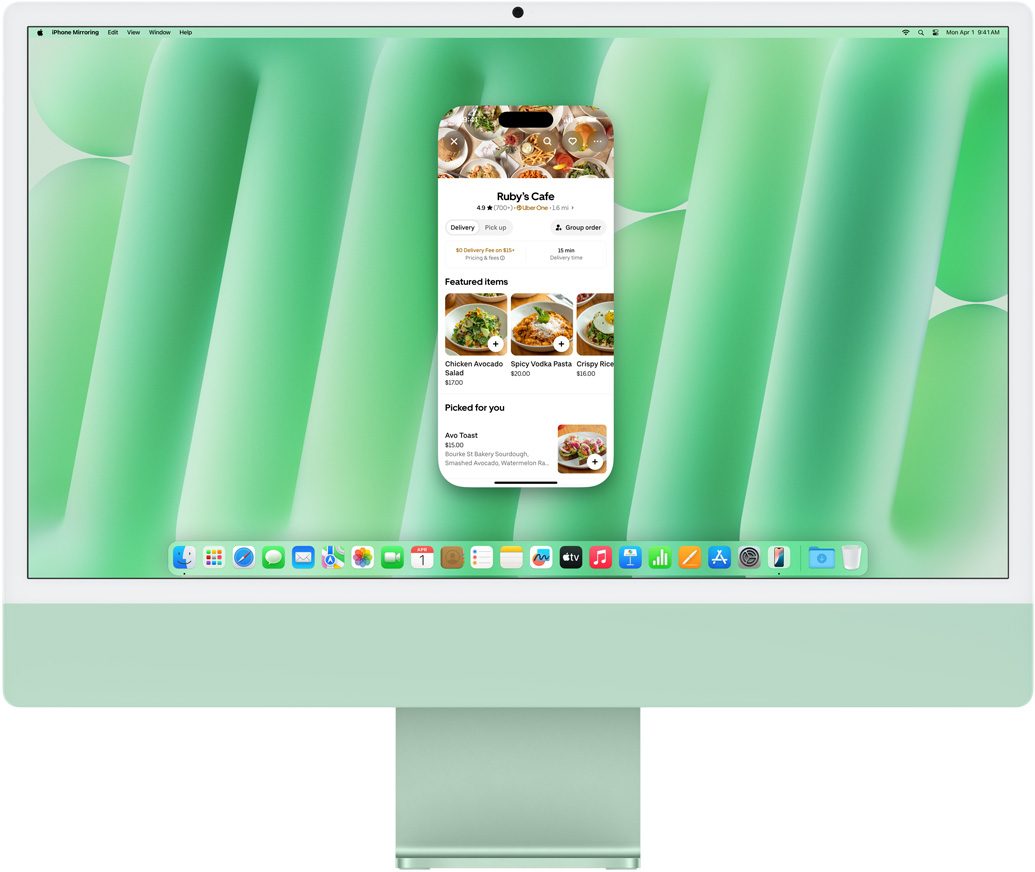 iPhone 鏡像輸出功能示範。iPhone 螢幕展示的 Uber Eats app 鏡像輸出至 iMac 並在 iMac 上操控。